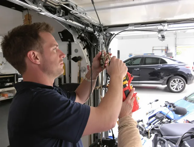Brookfield Garage Door Repair safety certified technician performing cable replacement in Brookfield